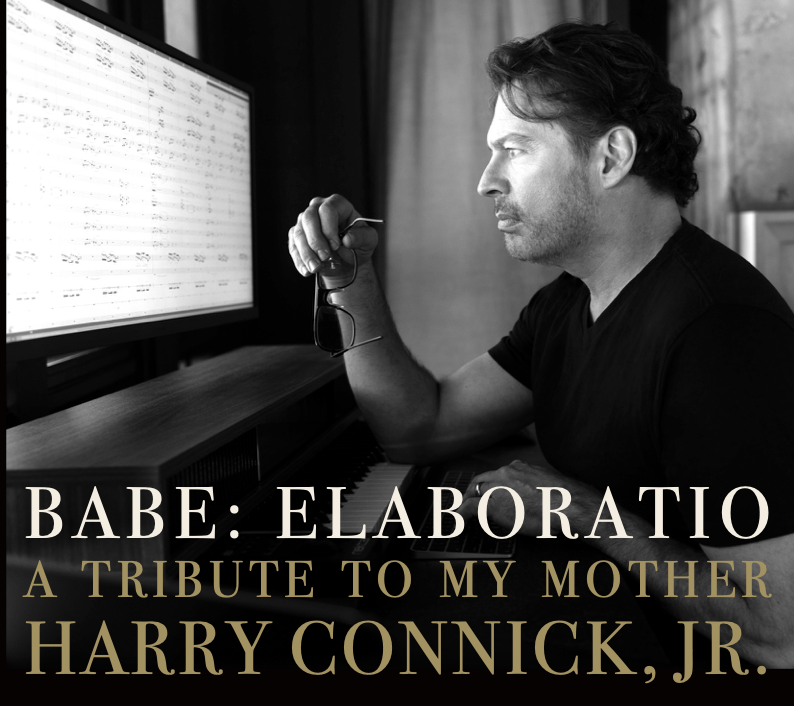 Harry Connick, Jr. at the piano, studying the orchestral score for Babe: Elaboratio. The album title and his name are printed across the lower third.